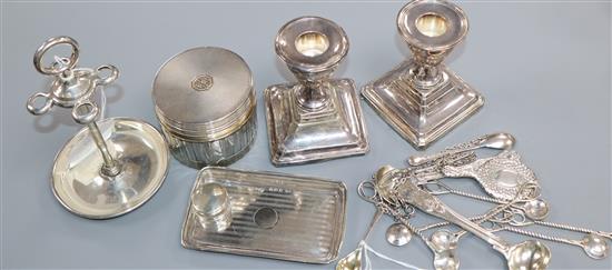 A pair of dwarf candlesticks, a silver stand, a toilet jar, a small tray, a small mirror, a pill jar and minor silver flatware